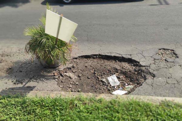 En colonia Lucio Blanco están hartos de baches en Xalapa