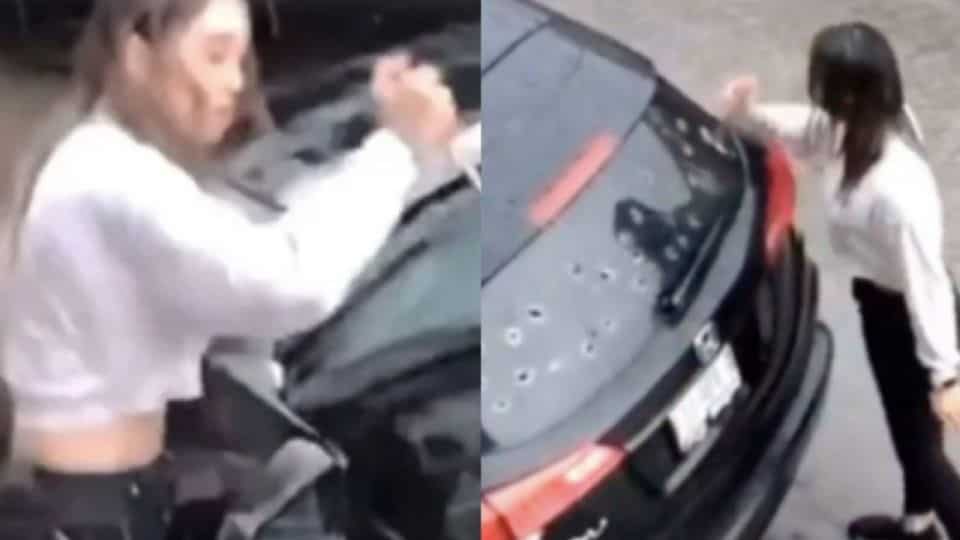 Despechada mujer destruye auto al descubrir infidelidad de su novio (Video)