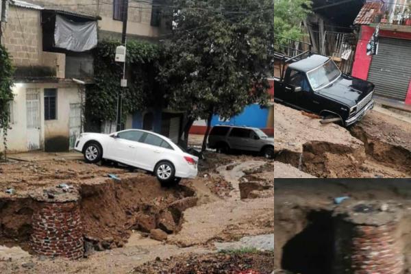 Lluvias en Xalapa provocan enorme socavón; afecta a dos autos