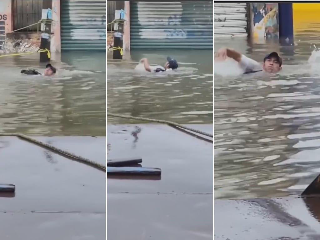 Porteño aprovecha aguacero para nadar en calle inundada de Coatzacoalcos | VIDEO