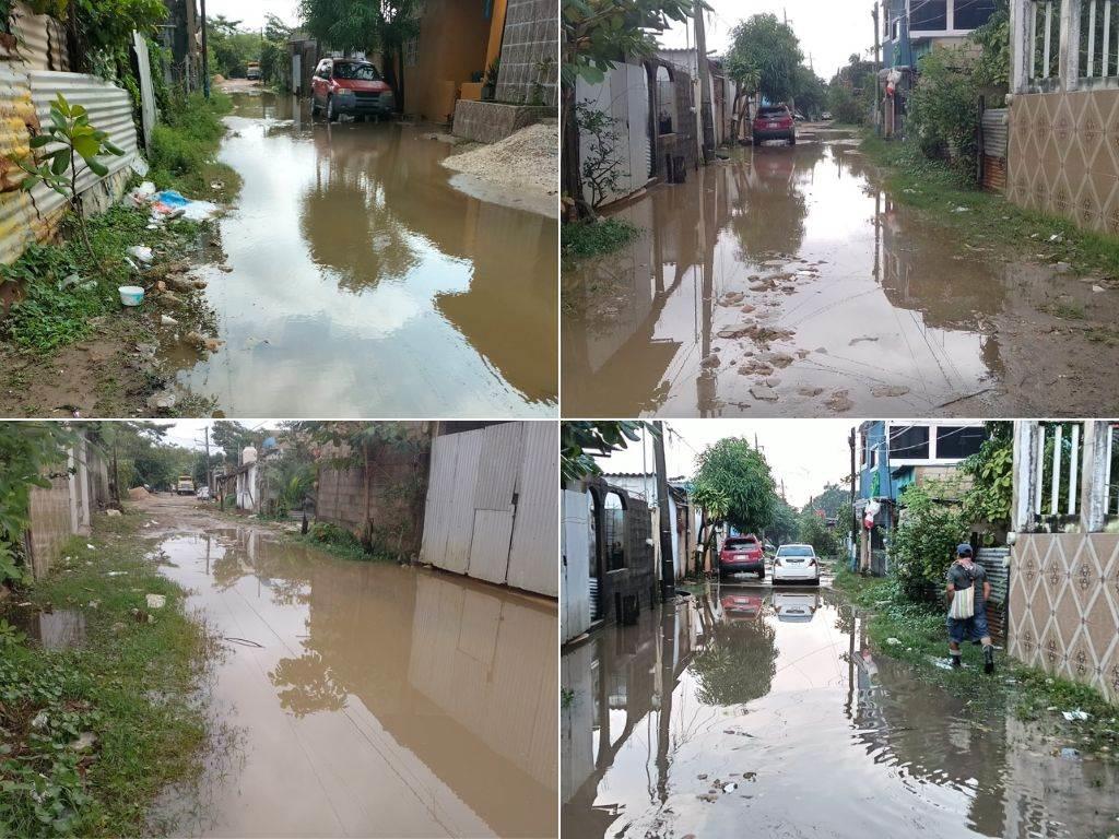 Claman pavimentación en la colonia Villas del Sur: vecinos caminan entre el agua